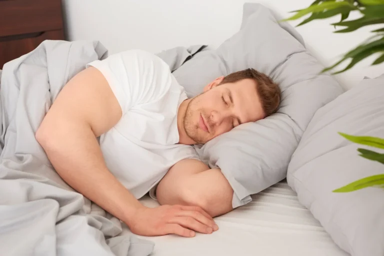 man sleeping comfortable bed