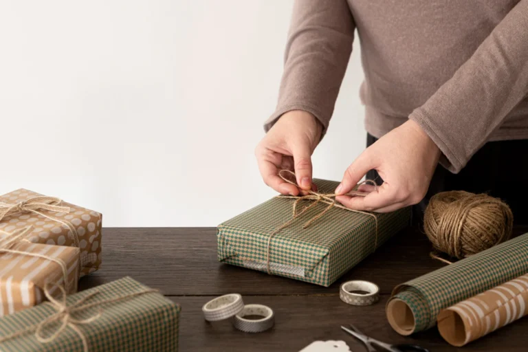 person wrapping christmas gift