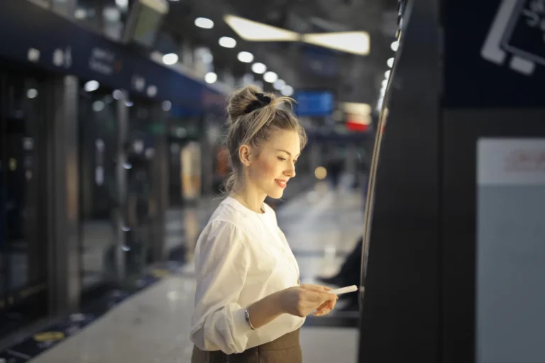 woman buys ticket subway
